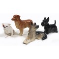 A group of four Beswick dogs, comprising 'Bulldog', model 1872, white, pale tan ear and around eyes ... 