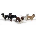 A group of five Beswick dogs, comprising a 'Sheepdog - Small', model 1854, black and white - gloss, ... 