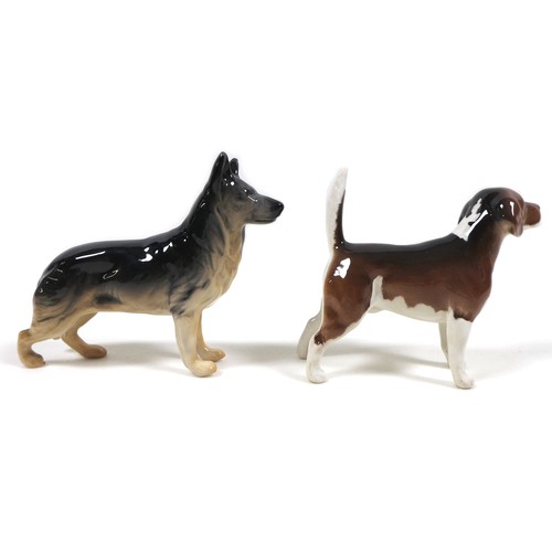 46 - A group of five Beswick dogs, comprising 'Labrador - Small', model 1956, black - gloss, 8.3cm high, ... 