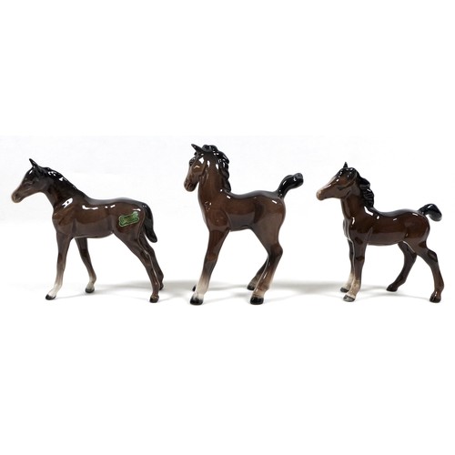 81 - A group of seven Beswick foals and young horses, including 'Foal (Small, stretched, facing left)', m... 