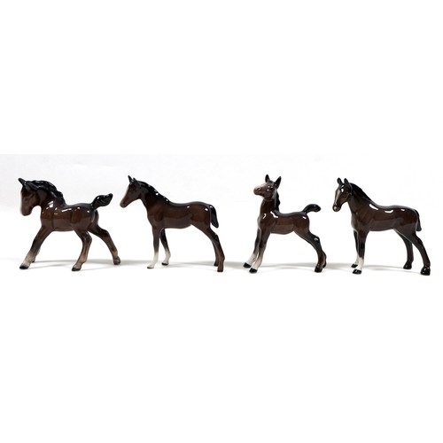 81 - A group of seven Beswick foals and young horses, including 'Foal (Small, stretched, facing left)', m... 