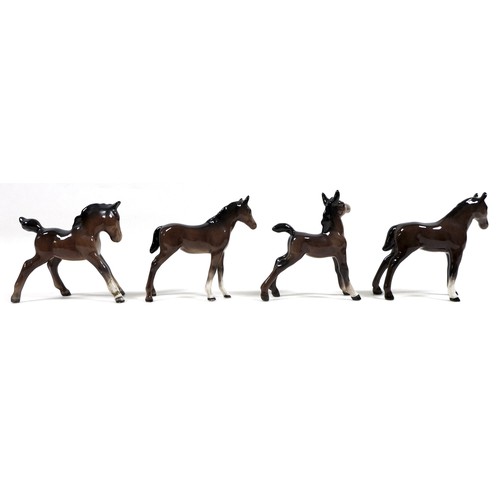 81 - A group of seven Beswick foals and young horses, including 'Foal (Small, stretched, facing left)', m... 