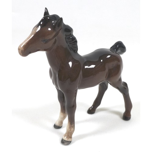 81 - A group of seven Beswick foals and young horses, including 'Foal (Small, stretched, facing left)', m... 