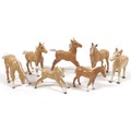 A group of seven Beswick foal figurines, including 'Foal (Small, stretched, facing right), model 815... 