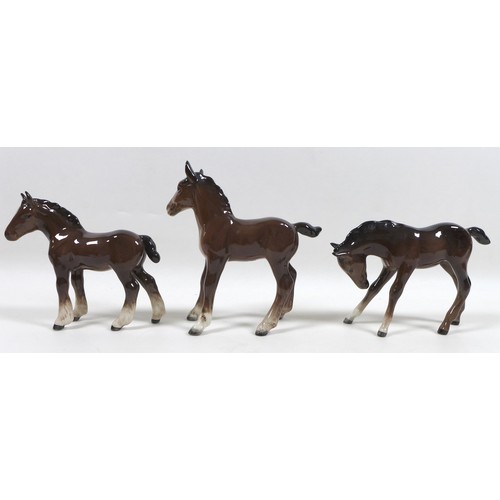 88 - A group of four Beswick foal figurines, including 'Shire Foal (Small)', model 1053, brown - gloss, 1... 