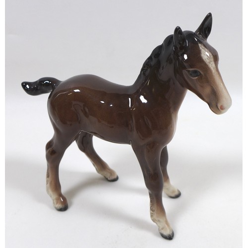 88 - A group of four Beswick foal figurines, including 'Shire Foal (Small)', model 1053, brown - gloss, 1... 