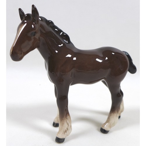 88 - A group of four Beswick foal figurines, including 'Shire Foal (Small)', model 1053, brown - gloss, 1... 