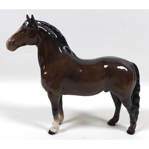 90 - A group of three Beswick horses, including 'Mare (Facing right, head down)', model 1812, brown - glo... 