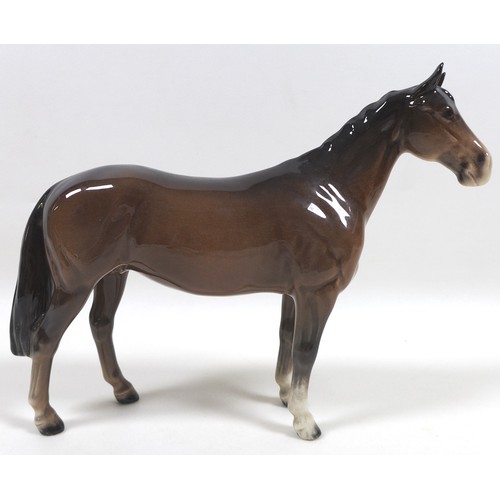 90 - A group of three Beswick horses, including 'Mare (Facing right, head down)', model 1812, brown - glo... 