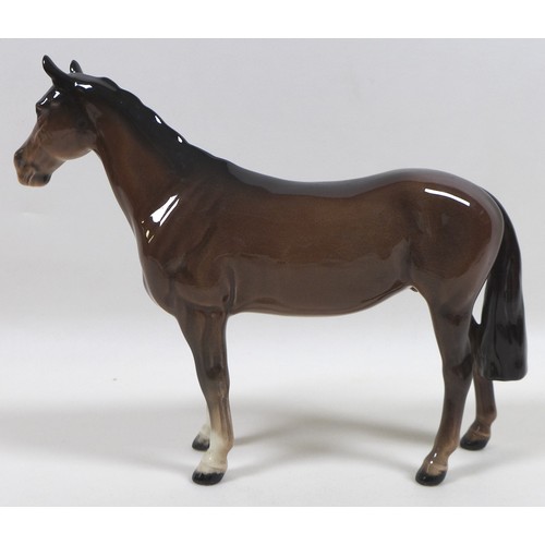 90 - A group of three Beswick horses, including 'Mare (Facing right, head down)', model 1812, brown - glo... 