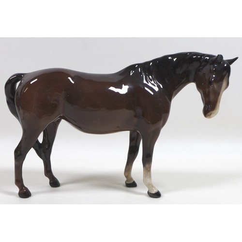 90 - A group of three Beswick horses, including 'Mare (Facing right, head down)', model 1812, brown - glo... 