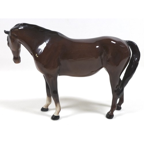 90 - A group of three Beswick horses, including 'Mare (Facing right, head down)', model 1812, brown - glo... 