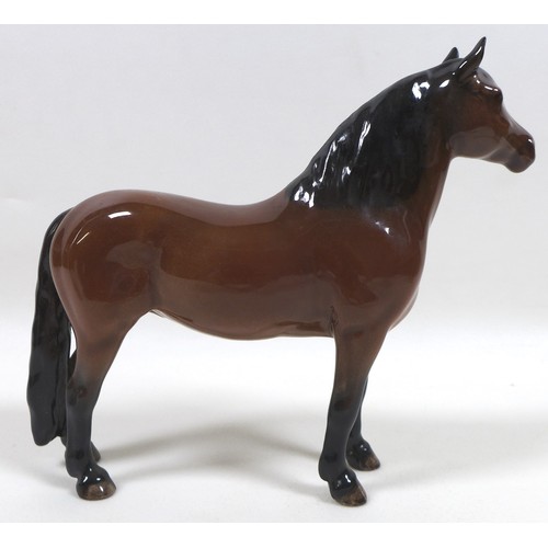 94 - A group of four Beswick horses, including two 'Pony (Head up)', model 1197, brown - gloss, 14cm high... 