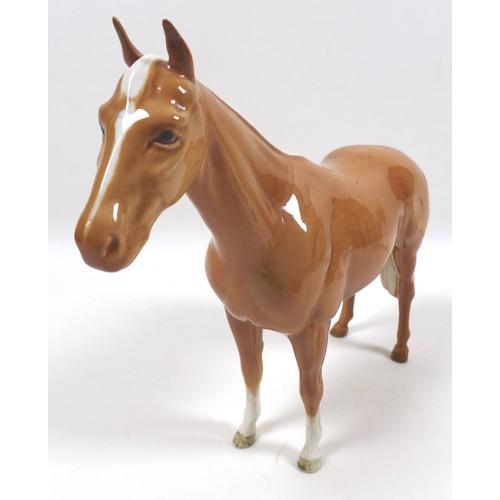 97 - Two palomino Beswick horses, including 'Imperial', model 1557, palomino - gloss, 20.5cm high, and '