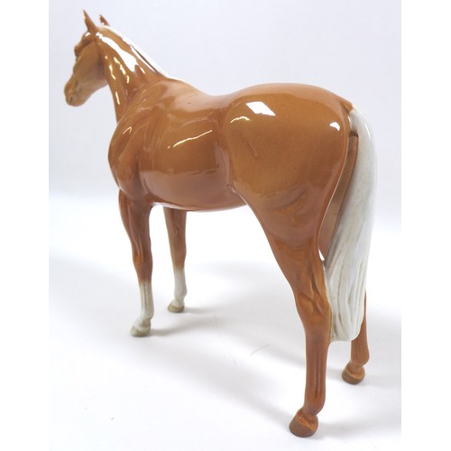 97 - Two palomino Beswick horses, including 'Imperial', model 1557, palomino - gloss, 20.5cm high, and '