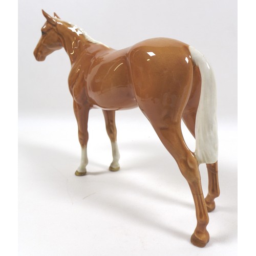 97 - Two palomino Beswick horses, including 'Imperial', model 1557, palomino - gloss, 20.5cm high, and '