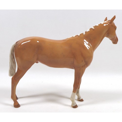 98 - Two palomino Beswick horses, comprising '