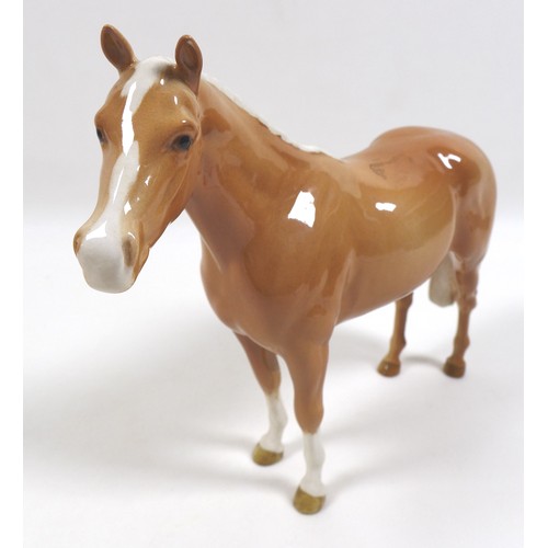 98 - Two palomino Beswick horses, comprising '