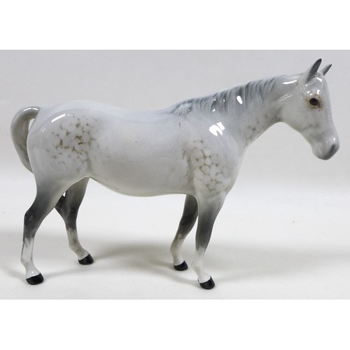 101 - A group of four grey Beswick horses, including 'Foal (Grazing), Second Version, model 946, grey - gl... 