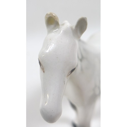 101 - A group of four grey Beswick horses, including 'Foal (Grazing), Second Version, model 946, grey - gl... 