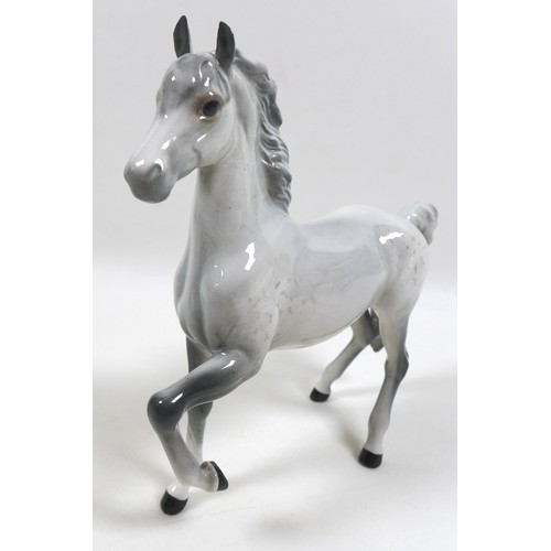 103 - A group of three Beswick horses and ponies, including 'Connemara Pony 