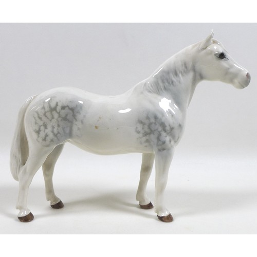 103 - A group of three Beswick horses and ponies, including 'Connemara Pony 