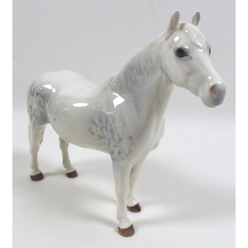 103 - A group of three Beswick horses and ponies, including 'Connemara Pony 