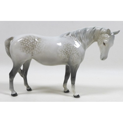 104 - A group of three Beswick horses, including 'Mare (Facing right, head down), model 1812. grey - gloss... 