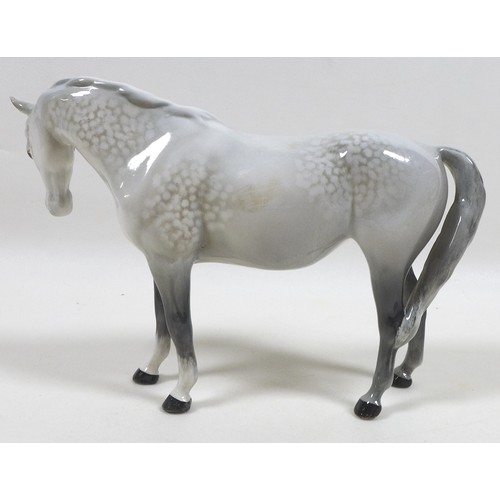 104 - A group of three Beswick horses, including 'Mare (Facing right, head down), model 1812. grey - gloss... 