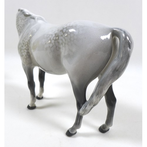 104 - A group of three Beswick horses, including 'Mare (Facing right, head down), model 1812. grey - gloss... 