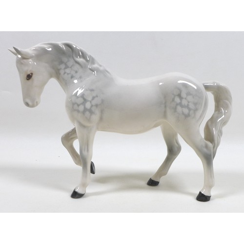 104 - A group of three Beswick horses, including 'Mare (Facing right, head down), model 1812. grey - gloss... 