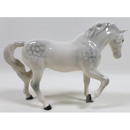 104 - A group of three Beswick horses, including 'Mare (Facing right, head down), model 1812. grey - gloss... 