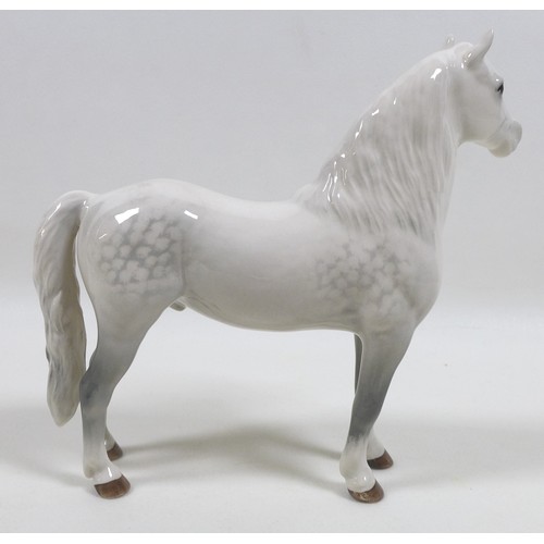 104 - A group of three Beswick horses, including 'Mare (Facing right, head down), model 1812. grey - gloss... 