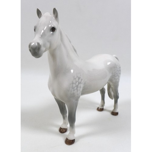 104 - A group of three Beswick horses, including 'Mare (Facing right, head down), model 1812. grey - gloss... 