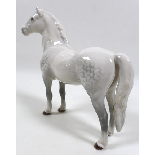 104 - A group of three Beswick horses, including 'Mare (Facing right, head down), model 1812. grey - gloss... 