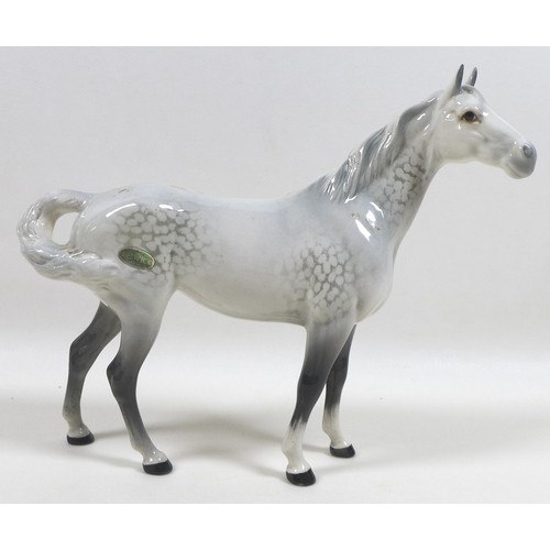 105 - Two large Beswick horses, comprising 'Swish Tail Horse', model 1182, grey - gloss, 22.2cm high, and ... 