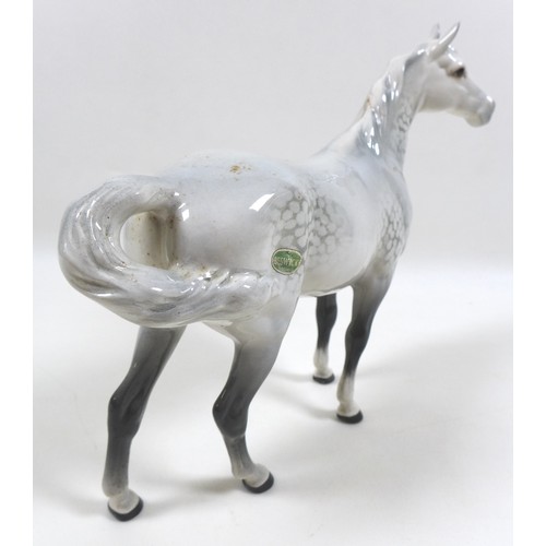 105 - Two large Beswick horses, comprising 'Swish Tail Horse', model 1182, grey - gloss, 22.2cm high, and ... 