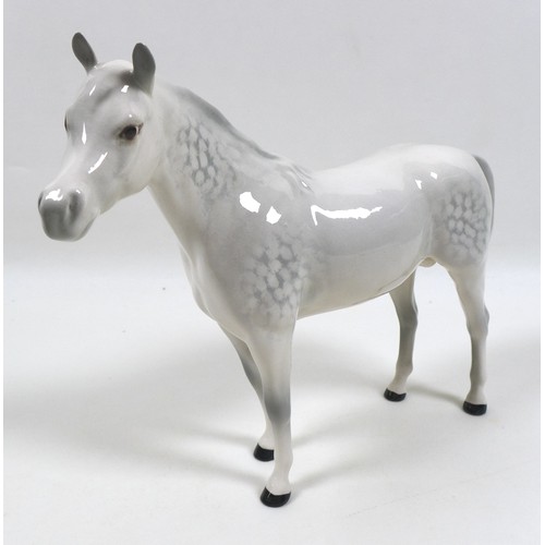 107 - A Beswick figurine modelled as 'Mare (facing left)', model 976, grey - gloss, 17.2cm high, together ... 