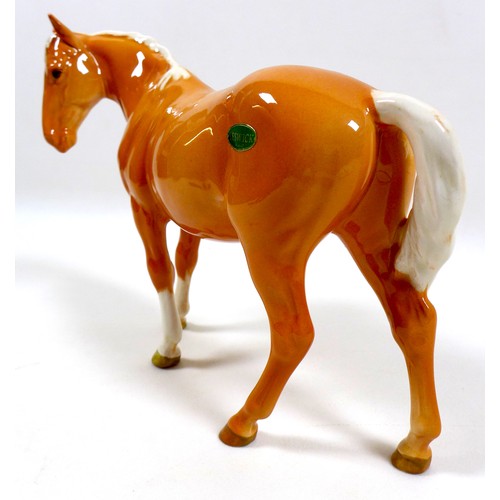 112 - Two Beswick palomino horse figurines, including 'Mare (facing left)', model 976, palomino - gloss, 1... 