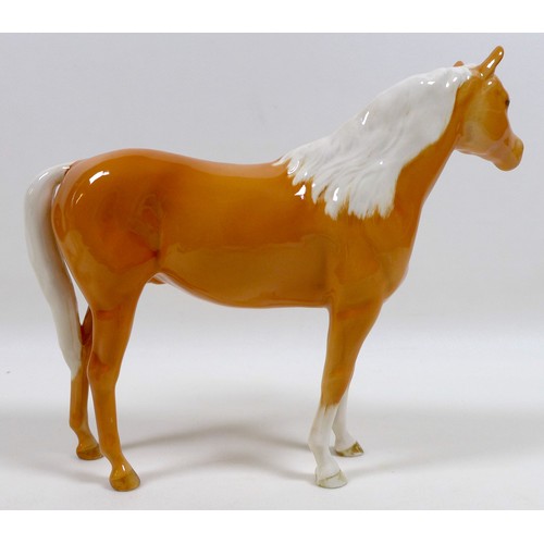 112 - Two Beswick palomino horse figurines, including 'Mare (facing left)', model 976, palomino - gloss, 1... 