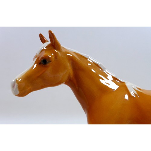 112 - Two Beswick palomino horse figurines, including 'Mare (facing left)', model 976, palomino - gloss, 1... 