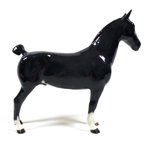 113 - A group of three Beswick horses, including 'Hackney - Black Magic of Nork', model 1361, black - glos... 