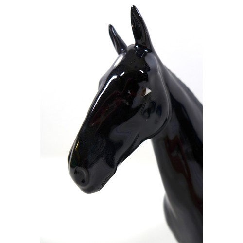 113 - A group of three Beswick horses, including 'Hackney - Black Magic of Nork', model 1361, black - glos... 