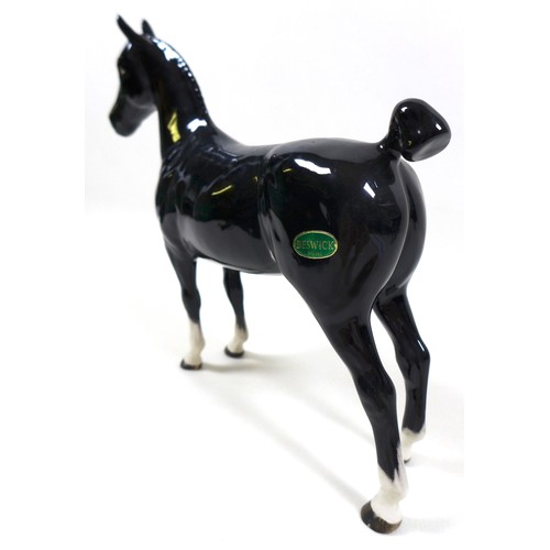 113 - A group of three Beswick horses, including 'Hackney - Black Magic of Nork', model 1361, black - glos... 