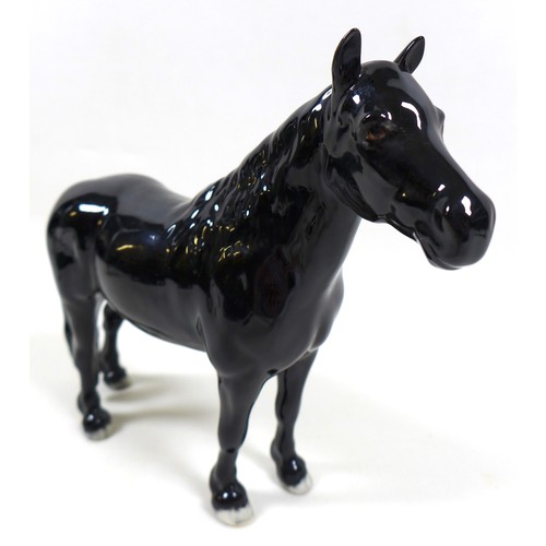 113 - A group of three Beswick horses, including 'Hackney - Black Magic of Nork', model 1361, black - glos... 