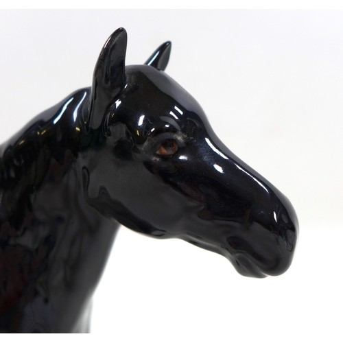 113 - A group of three Beswick horses, including 'Hackney - Black Magic of Nork', model 1361, black - glos... 