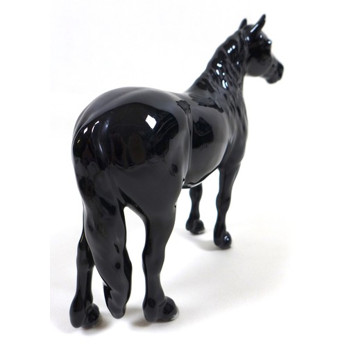 113 - A group of three Beswick horses, including 'Hackney - Black Magic of Nork', model 1361, black - glos... 