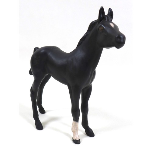 113 - A group of three Beswick horses, including 'Hackney - Black Magic of Nork', model 1361, black - glos... 