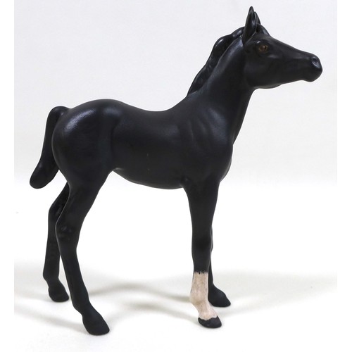 113 - A group of three Beswick horses, including 'Hackney - Black Magic of Nork', model 1361, black - glos... 