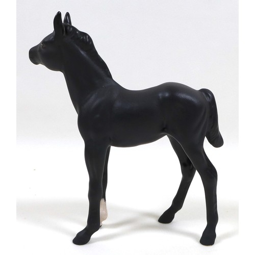 113 - A group of three Beswick horses, including 'Hackney - Black Magic of Nork', model 1361, black - glos... 